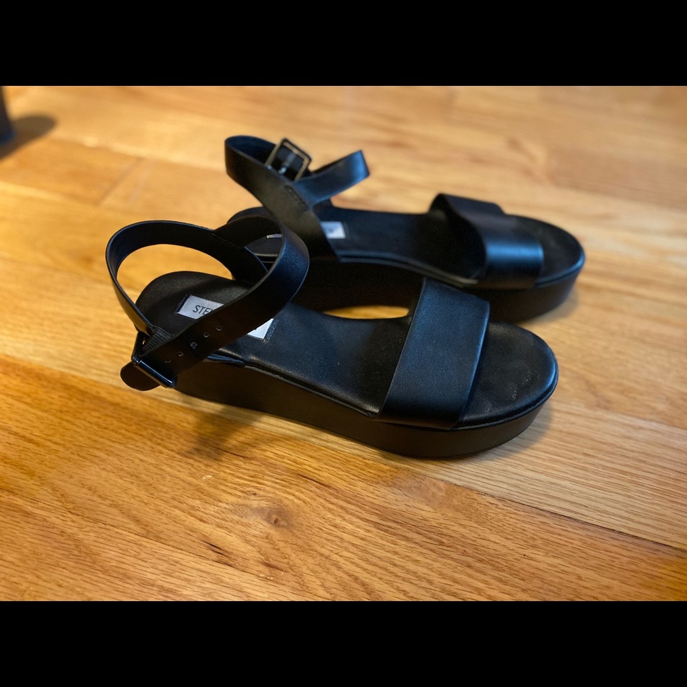 Steve Madden black platform sandals with buckle.